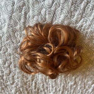 Curly‎ Hair Bun Extension in Auburn. Makes easy messy buns or sculpted styles.